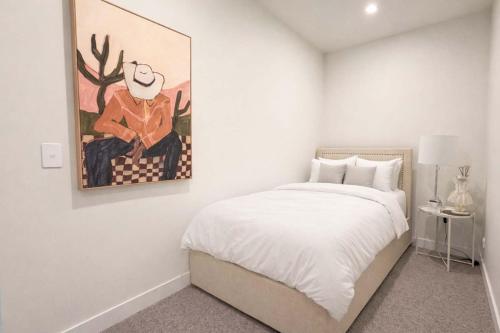 En eller flere senge i et værelse på Aspire Boutique Condo Melbourne CBD