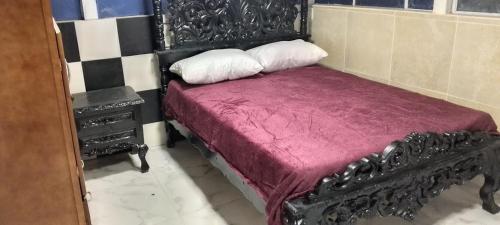 En eller flere senge i et værelse på casa de hospedaje urcunina