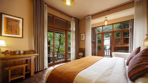 Postel nebo postele na pokoji v ubytování Moondance Boutique Resort