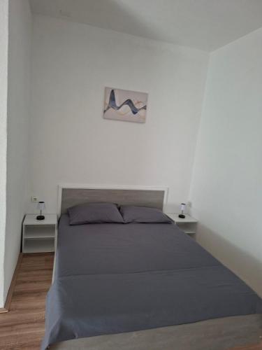 Llit o llits en una habitació de M & A Apartmani