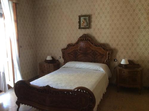 a bedroom with a large bed and two night stands at Ca Bienvenida in Miramar