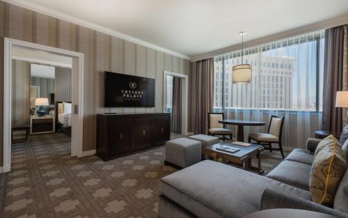 a living room with a couch and a table at Caesars Palace Hotel & Casino in Las Vegas