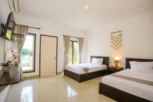 Een bed of bedden in een kamer bij New Bintang Mandalika