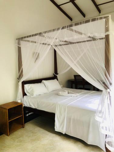 Un pat sau paturi într-o cameră la Villa Sunshine