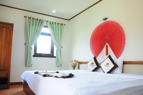 Postel nebo postele na pokoji v ubytování Vela Phu Quoc Resort