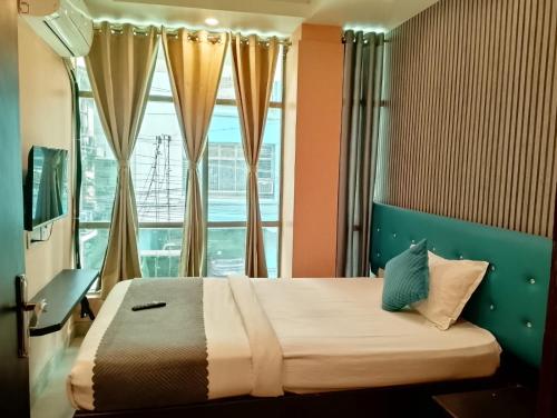 Ένα ή περισσότερα κρεβάτια σε δωμάτιο στο Hotel Hill View