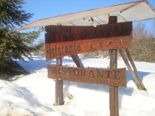 a sign in the snow next to at Hotel Cristal in Roccaraso