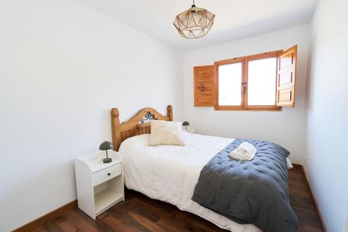 Giường trong phòng chung tại El Rincón del Valle VUT-LE-1603