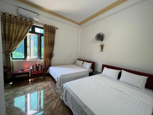 En eller flere senge i et værelse på Huy hoang hotel