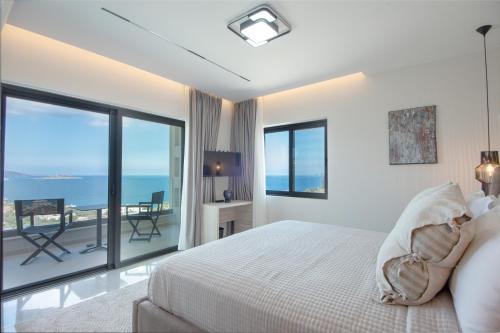 En eller flere senge i et værelse på Ozen Luxury Villa and Suite