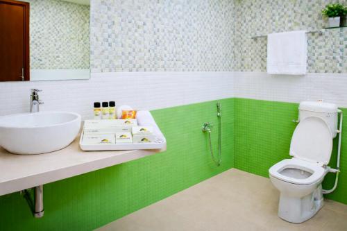 Et badeværelse på Darwar Palace By Av Hotel