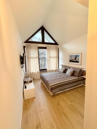 En eller flere senge i et værelse på Appartamento Weissmatten