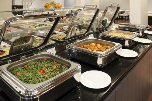 a buffet line with many different types of food at Diune Resort by Zdrojowa in Kołobrzeg