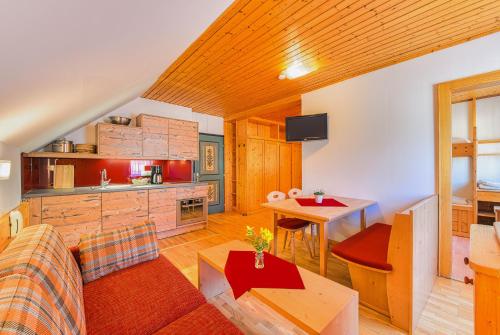 a living room with a couch and a table at Allesbauer - Familie Preis in Trebesing