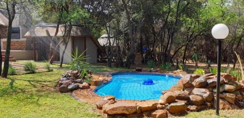 Het zwembad bij of vlak bij Harties Safari View