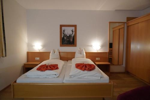 En eller flere senge i et værelse på Gasthof Haidbach