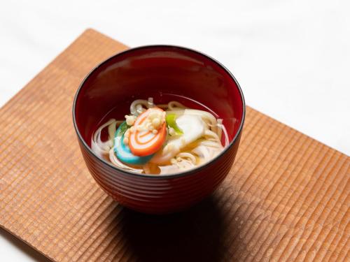 a red cup filled with soup on a napkin at APA Hotel Uozu Ekimae in Uozu