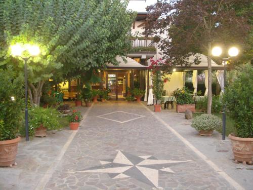 a walkway with a star on it in front of a building at Hotel da Rosanna in Attigliano