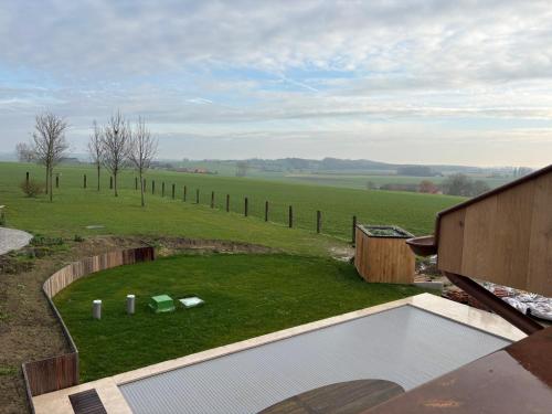 a view of a field from a house at Tjusteplekske in Heuvelland
