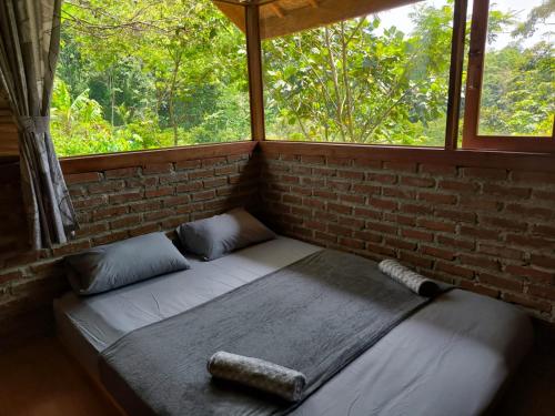 Postel nebo postele na pokoji v ubytování Farmstay Manangel