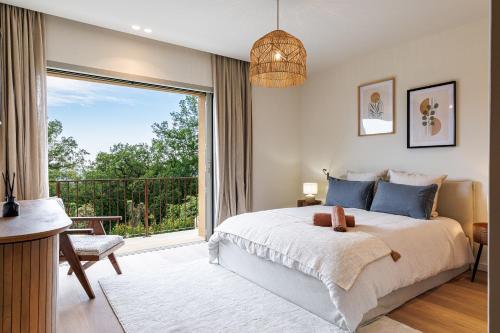 Postel nebo postele na pokoji v ubytování Villa Maynaya