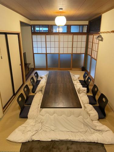 a conference room with a large table and chairs at Huis Tashiro in Yuzawa