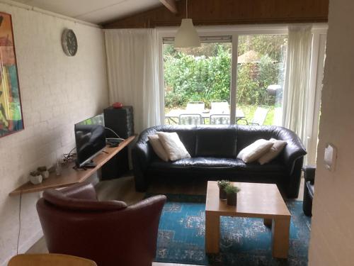 Et opholdsområde på Bungalow including 4 bikes