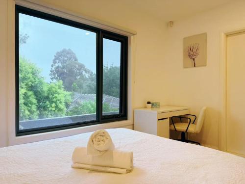 En eller flere senge i et værelse på Home of Ringwood - Wilana