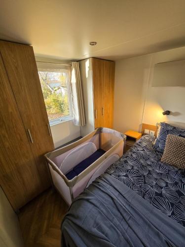 a bedroom with a large bed in a room at Het Strandnest in Renesse