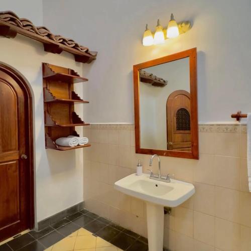 a bathroom with a sink and a mirror at Encuentros in Granada