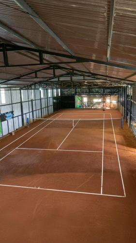 a tennis court in a building with a tennis court at Cabaña Mirador de ballenas,Chiloé in Ancud