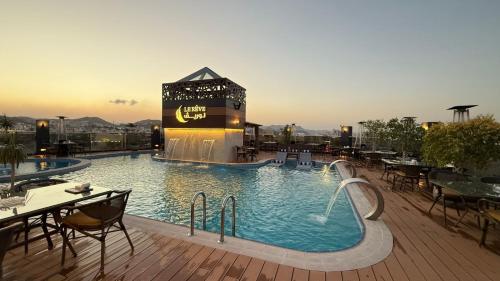 Bazén v ubytování Le Reve Hotel إحدى فنادق مجموعة لوريف By Le Reve Company nebo v jeho okolí