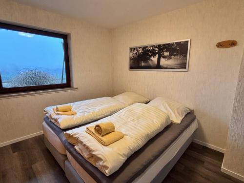 En eller flere senge i et værelse på Haus Aktiv Garten2