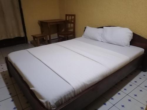 Giường trong phòng chung tại Viva Lodge