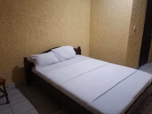 Giường trong phòng chung tại Viva Lodge