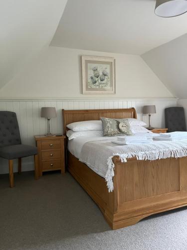 En eller flere senge i et værelse på Red Squirrel Cottage
