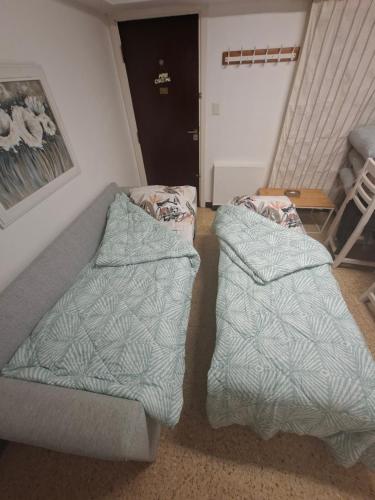 En eller flere senge i et værelse på Los Dias de Viaje