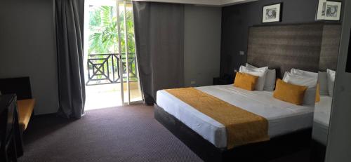 Postel nebo postele na pokoji v ubytování LTH Las Terrenas Hotel