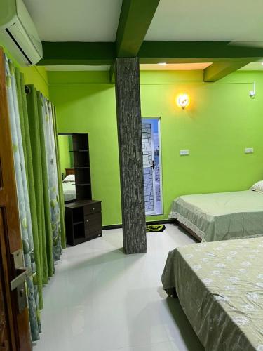 Ένα ή περισσότερα κρεβάτια σε δωμάτιο στο Shan guest rooms