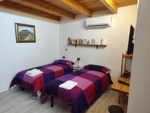 Postel nebo postele na pokoji v ubytování BeB Silvia