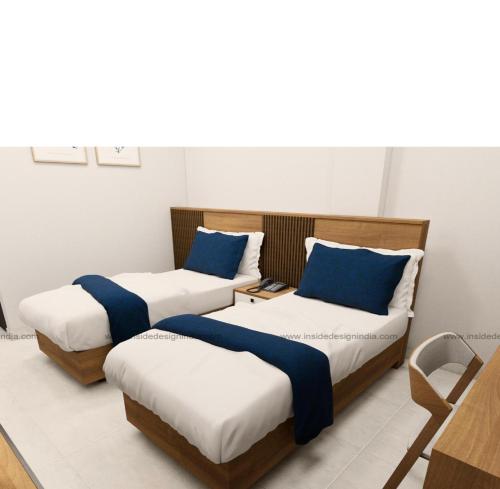 En eller flere senge i et værelse på Spectra Health & Suite