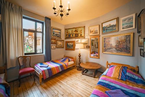 En eller flere senge i et værelse på Guest House Malkia Inter