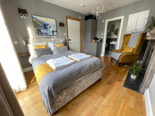 a bedroom with a bed with two pillows on it at Millpool House in Dartmouth