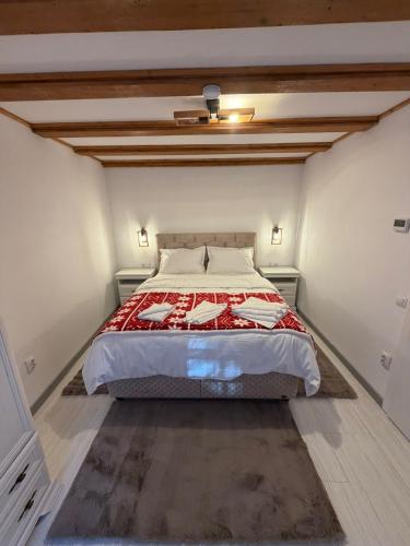 a bedroom with a large bed in a room at Casa Criss in Sinaia