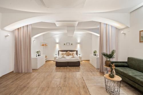 a living room with a bed and a couch at dreamfactory Residence - Eastside in Vienna