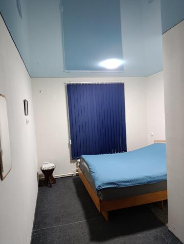 En eller flere senge i et værelse på Asian Guest House 5