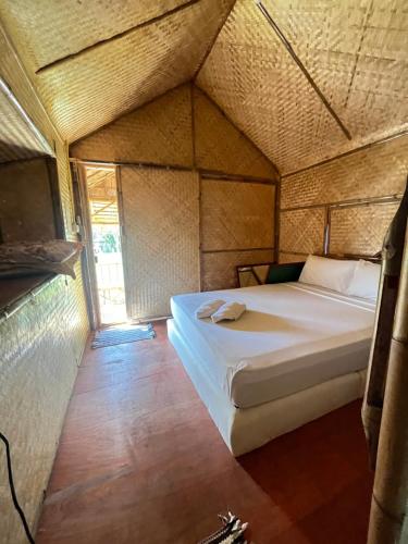 a bedroom in a yurt with a bed in it at Wooden House Koh Lanta in Ko Lanta