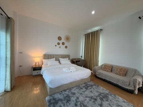 Postel nebo postele na pokoji v ubytování มานอนปัว โฮมสเตย์ น่าน Manornpua Homestay Nan