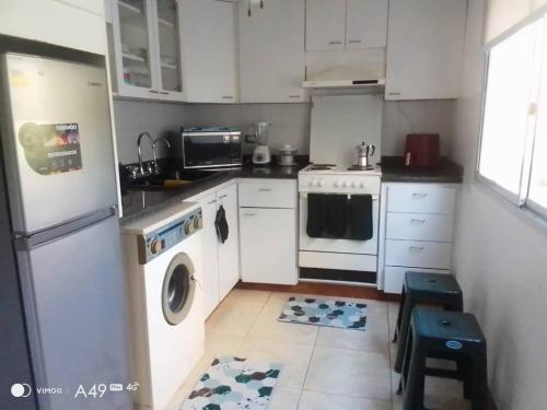 Køkken eller tekøkken på Aguamarina Suites