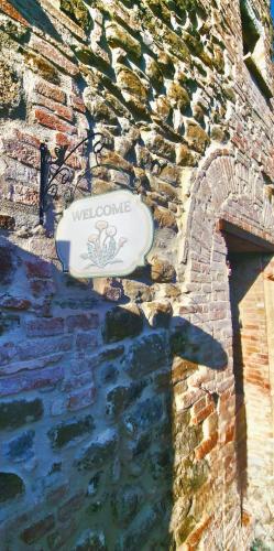 a frisbee is sitting on a stone wall at Torre del Tempo in Torgiano